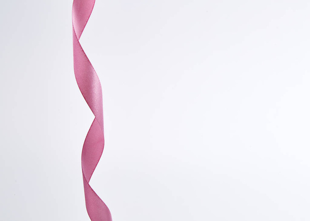 Pink curly ribbon isolated on white - Foto, Imagen