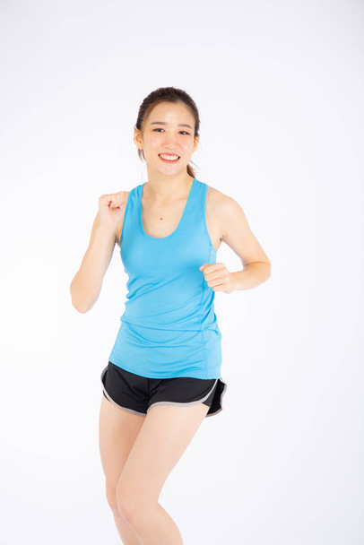 Beautiful young asian woman happy and smiling jogging isolated o - Foto, imagen