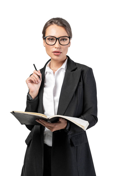 Confident young businesswoman with notebook - Foto, immagini