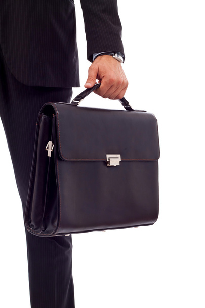 Business man holding a suitcase - Foto, afbeelding