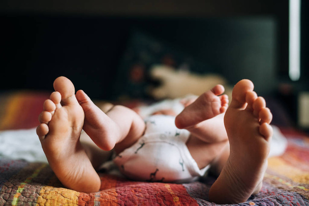 barefoot of two kids on the bed - Φωτογραφία, εικόνα