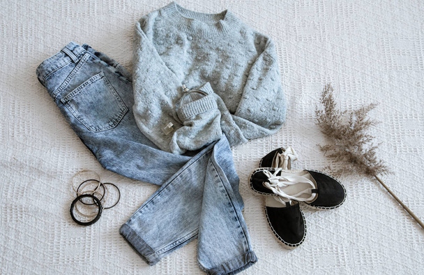 Set with fashionable women's clothing jeans and a sweater . - Photo, Image