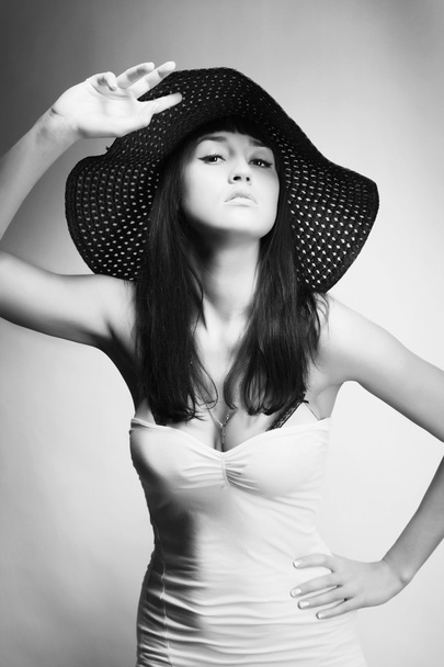 Woman posing in a hat - 写真・画像