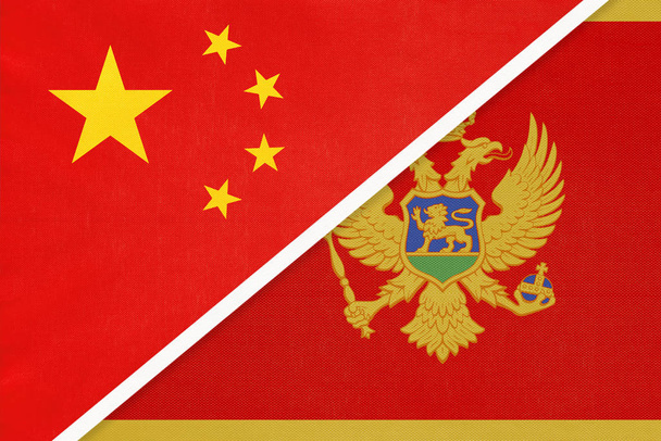 China or PRC vs Montenegro national flag from textile. Relationship between asian and european countries. - 写真・画像