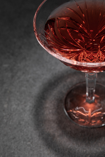 selective focus of glass with red wine on grey surface  - Photo, Image