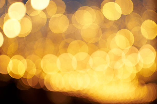 Festive backgroud with blurred golden and brown lights and bokeh - Foto, Imagem