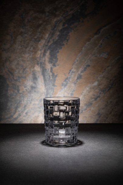 clean and empty glass on textured background  - Zdjęcie, obraz