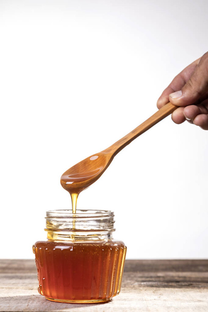 Golden honey, natural, golden, crystalline and healthy. - Zdjęcie, obraz