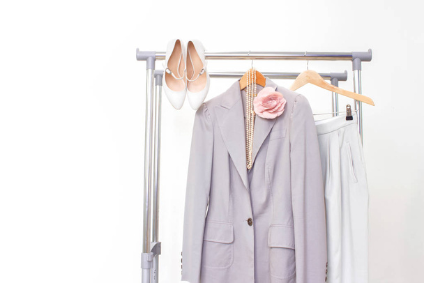 Minimal fashion clothes concept. Female clothes on hanger on white. Fashion blog, website, social media hero header. - Foto, imagen