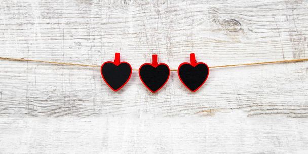 Valentines day with red hearts on wooden background - Фото, изображение