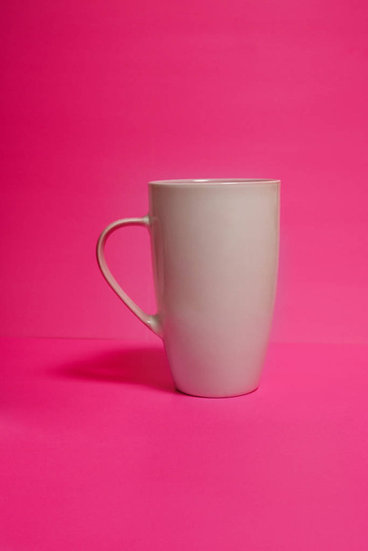 St Valentine's Day gift: White mug on the vivid pink backround - Photo, Image