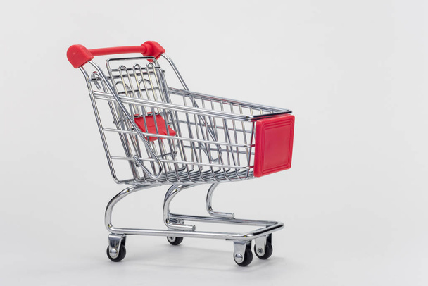 Empty grocery cart on white background - Foto, immagini