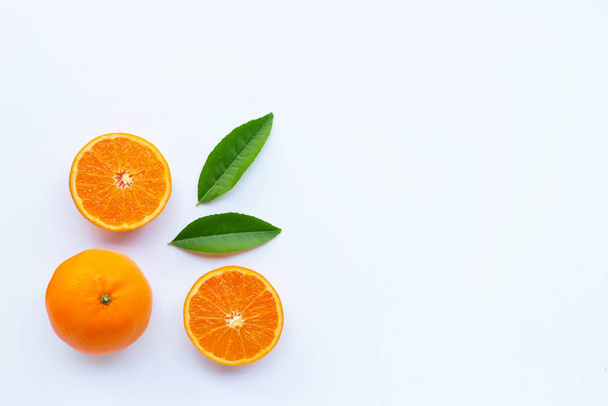High vitamin C,  Fresh orange citrus fruit with green leaves on white background. Copy space - Foto, Imagen
