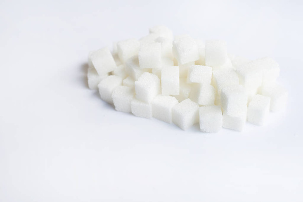Sugar cubes on  over white background - Fotoğraf, Görsel