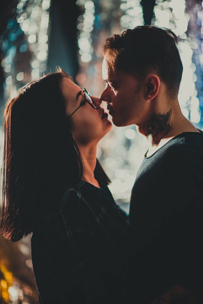 Beautiful couple kissing, on blurred smoke background. - Fotoğraf, Görsel