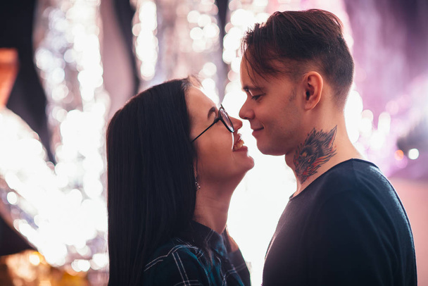guy and the girl kiss closeup on a light background - Fotó, kép