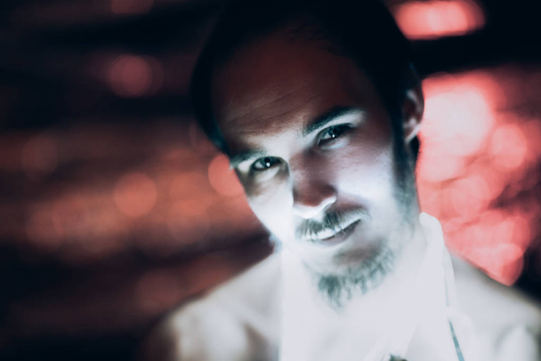 Portrait man Strip Light LED tape on dark color background. - Фото, изображение