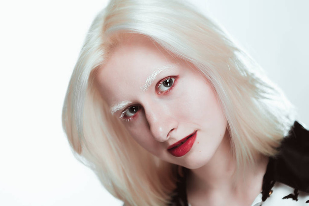 portrait of blonde albino girl in studio. - Fotó, kép