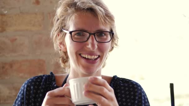 Woman with Eyeglasses Drinking Coffee - Video, Çekim