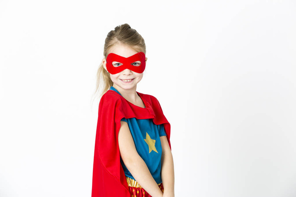 girl with red mask and supergirl outfit posing - Photo, Image