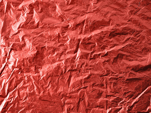 Abstract background made of Living Coral 2019 color. Festive backdrop for holidays and parties. Wrapping paper in Living Coral colour. Top view or flat lay. Copy sace for text - 写真・画像