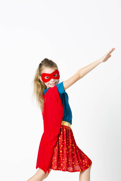 pretty blonde supergirl with red cape - Foto, Imagen