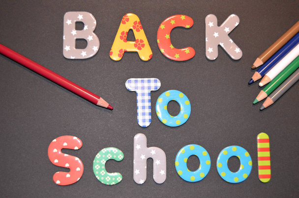 Illustration of the back to school with colored pencils and letters as background - Fotografie, Obrázek