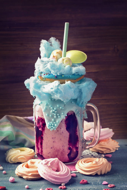 Blueberry freakshake with donuts and candy floss - Photo, Image