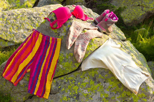 Ladies clothes on rocks - Photo, Image