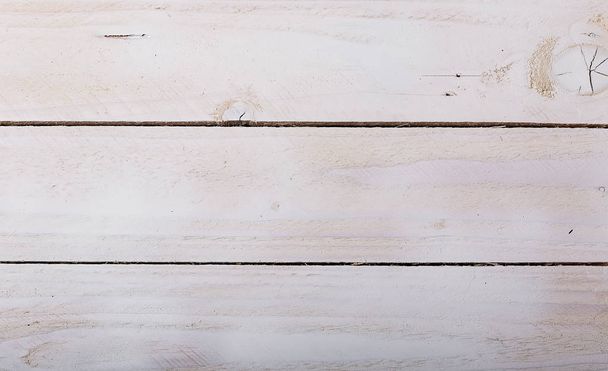 Old white soft wood pattern as background. Wooden planks on a wall or floor with texture. Light neutral flat faded tones. - Fotó, kép