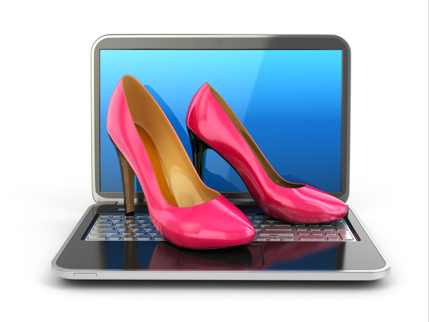 Online shopping. High heel shoes on laptop. - Foto, afbeelding
