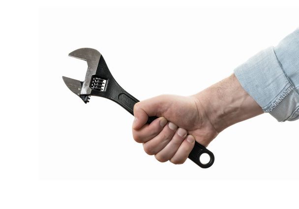 Male hand with black wrench. Concept of technical support. On white isolated background. Image - Foto, imagen