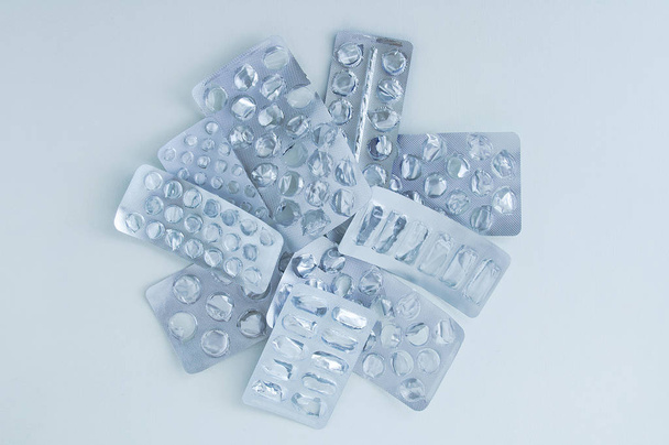 Empty silver packaging for medicines, pills on a white background. - Valokuva, kuva