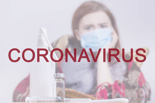 Coronavirus inscription in red. Against the background of a sick girl in a protective mask. Chinese pneumonia virus 2019-ncov - Valokuva, kuva
