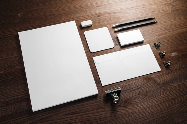 Blank corporate stationery for branding design. Corporate identity set on wooden background. - Foto, Imagen