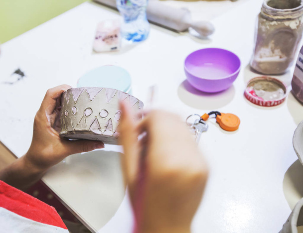 Creative children working on clay vase at pottery workshop. - Fotoğraf, Görsel