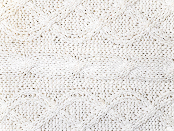 Texture of white woolen knitted fabric. - Fotoğraf, Görsel