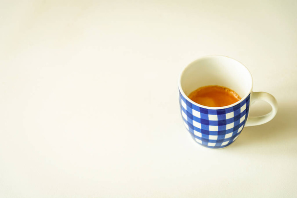 A cup of coffee with blue stripes isolated with a white background - Photo, Image
