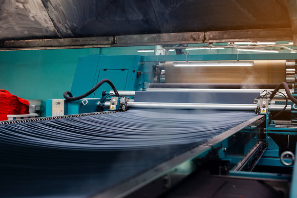 Textile Manufacturing. Circular knitted fabric. Textile factory in spinning production line and a rotating machinery and equipment production company. Clothing industry. Manufacturing textile fabrics. - Fotoğraf, Görsel
