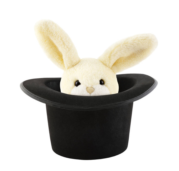 Rabbit toy appearing from a top hat isolated on white background - Foto, imagen
