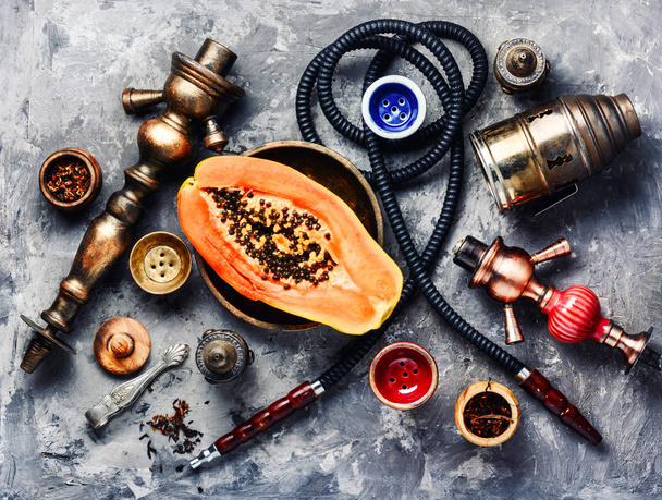 Oriental exotic hookah with papaya fruit flavor.Smoking Turkish shisha - Foto, Imagem