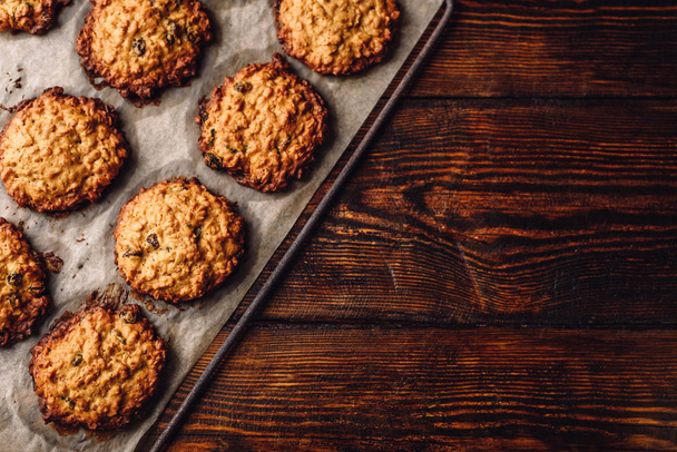Homemade Oatmeal Cookies with Raisins on Parchment Paper. View from Above. - Zdjęcie, obraz