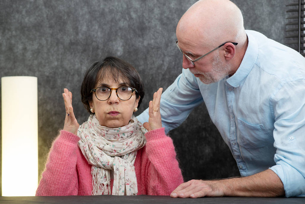 senior couple with problems at home, the woman angry - Foto, Imagem