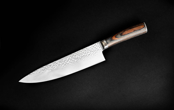 Chef's knife for your kitchen isolated on black background. With clipping path - Foto, imagen