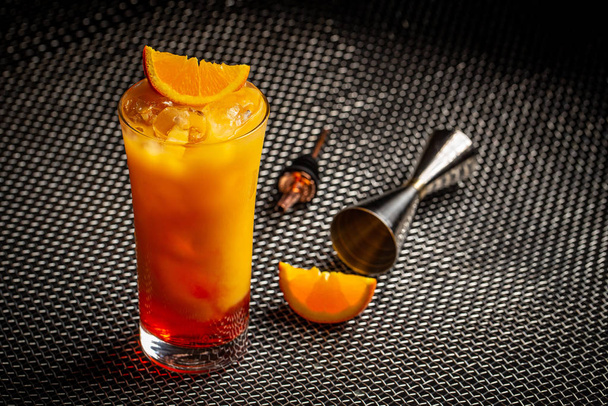Classic italian aperol orange cocktail in glass on dark background - Foto, imagen