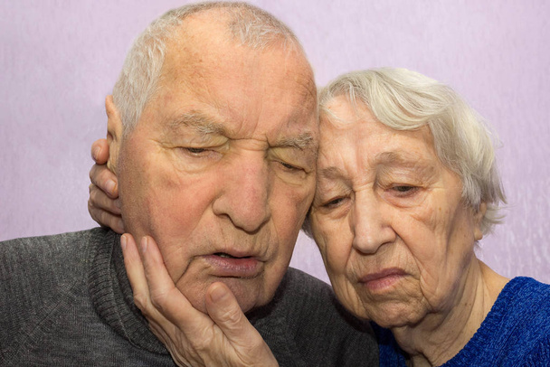 Portrait of a sad sick elder couple at home. The senior people and depression concept - Φωτογραφία, εικόνα