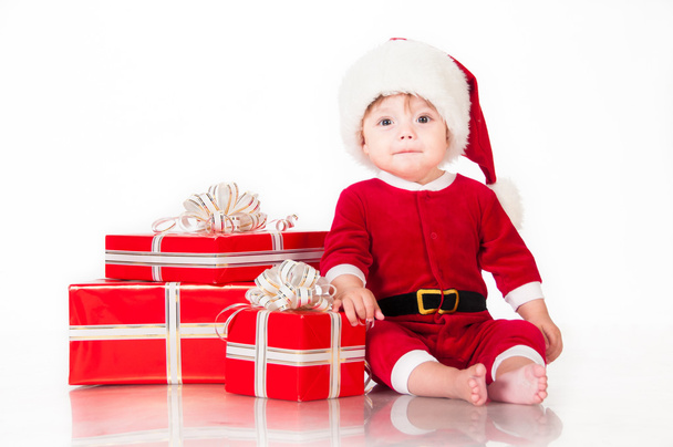 Cheerful little Santa Claus with presents. Isolated on white background. - Foto, Imagem