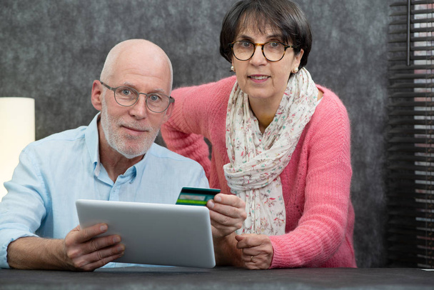 happy senior couple using a digital tablet - Photo, Image