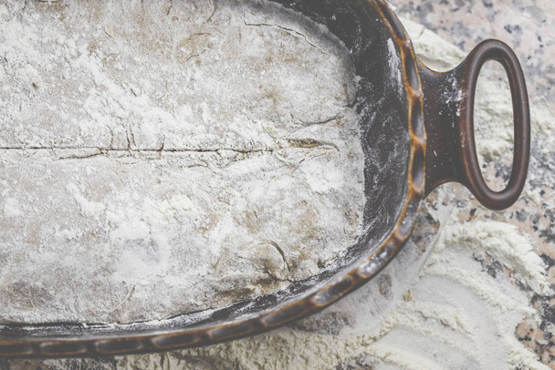 Bake bread - the finished bread, dusted with flour, fresh and crispy.  - Fotó, kép