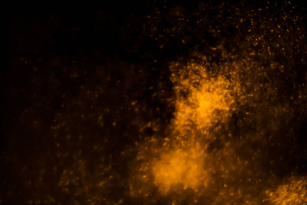 Abstract bokeh glitter background. Defocused background. Blurred bright light on black for overlay texture - 写真・画像